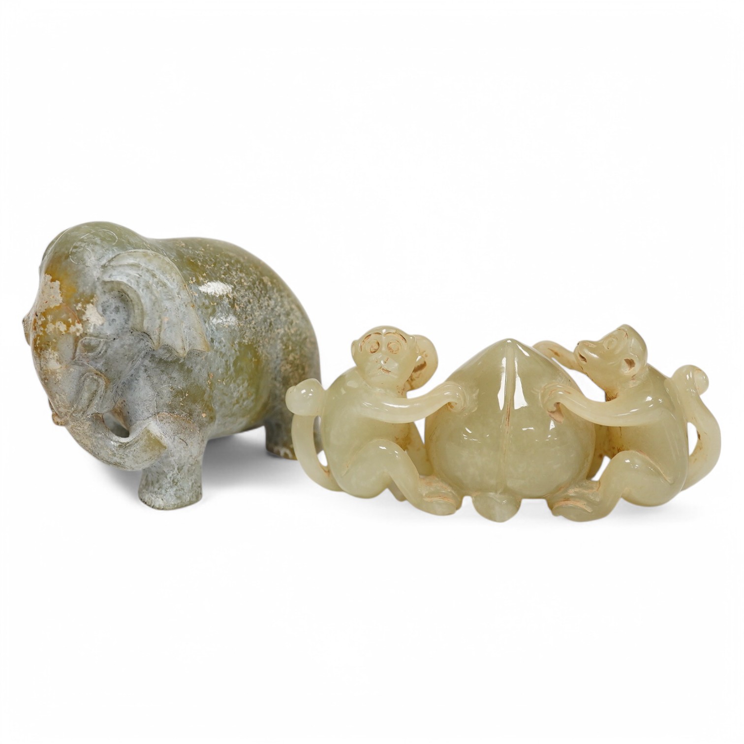 A Chinese jade monkey group and a bowenite jade elephant, largest 9cm wide. Condition - good (2)